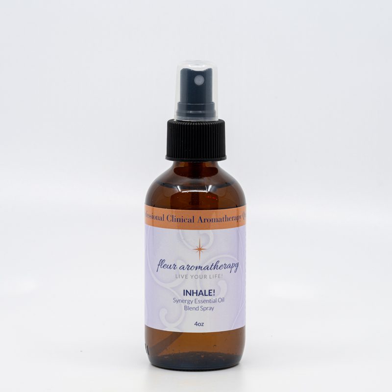 A bottle of aromatherapy spray sitting on top of a table.