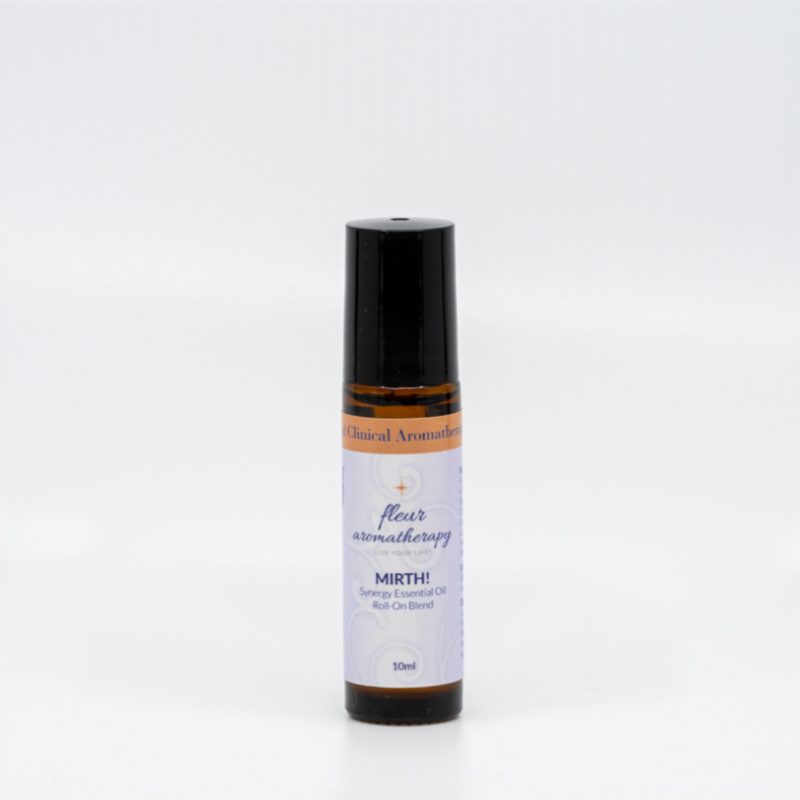 A roll on bottle of essential oil sitting next to a white wall.